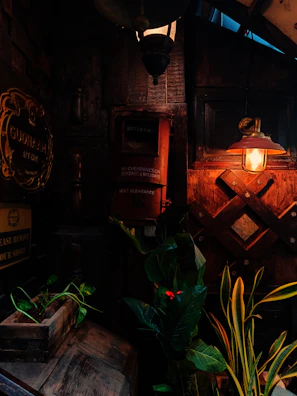 Warmly lit corner of Jharkraft cafe with rustic Jharkhandi decor and comfy seating.