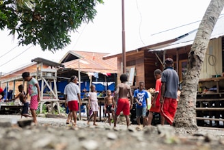 a group of people playing in a village