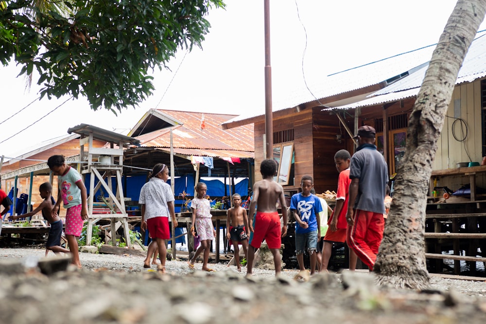 a group of people playing in a village