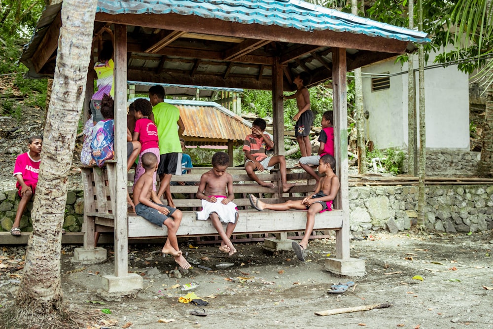 a group of people sitting on a bench