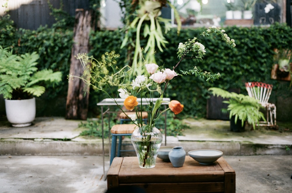 a vase with flowers on a table