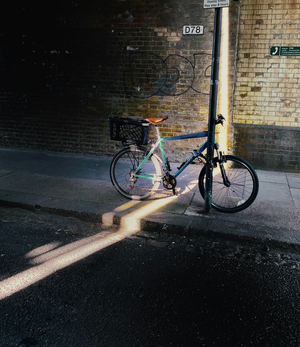 a bicycle parked on the side of a street