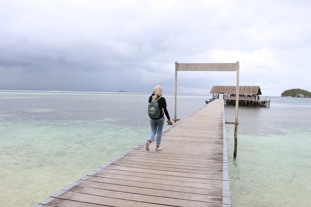 a man walking on a dock