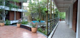 An intimate residential interior courtyard blending natural turf and artistic planters.