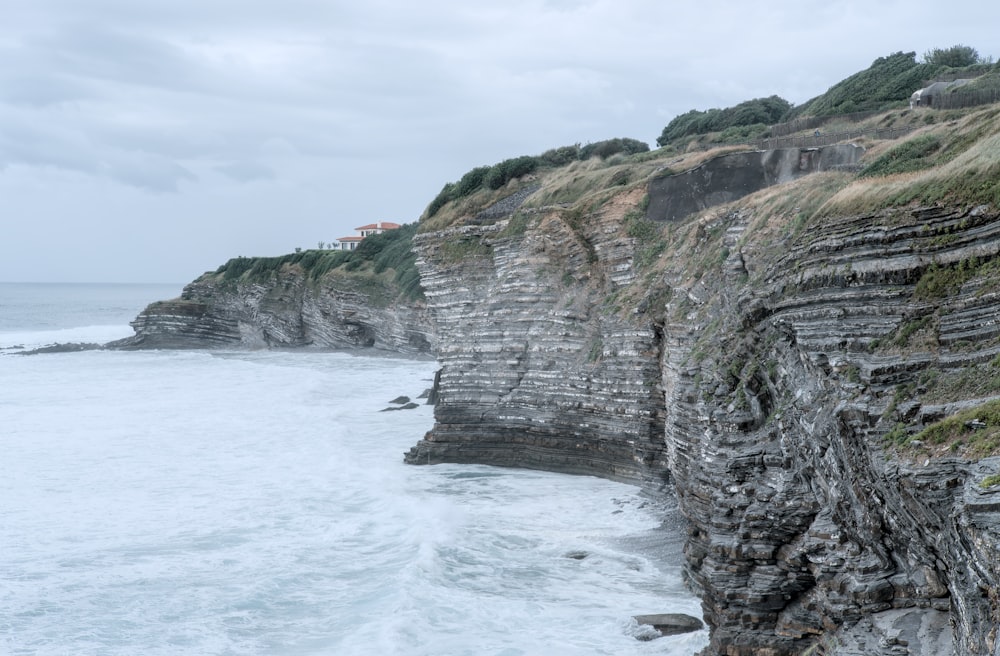 a cliff with a building on it