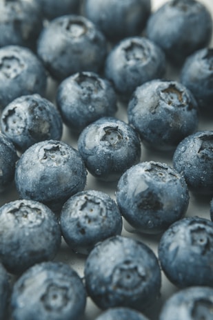 A close-up of fresh berries with ice crystals, highlighting their freshness.