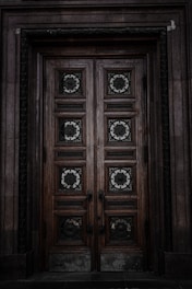 A beautifully crafted wooden door with intricate details.