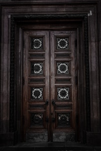 A beautifully crafted wooden door with intricate details.