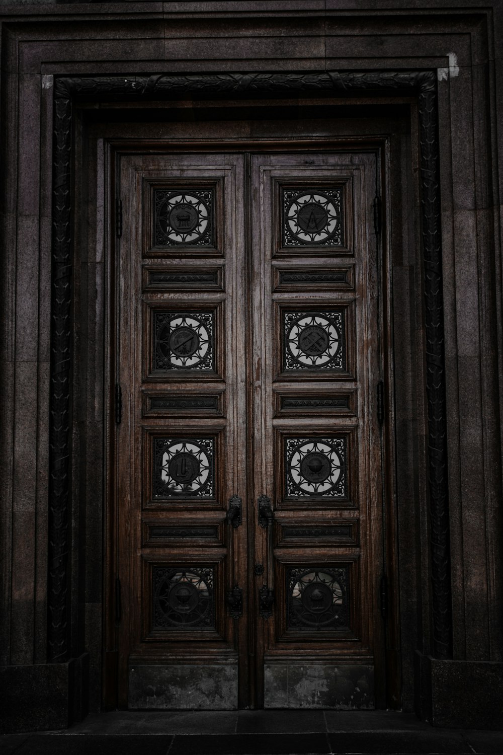 a wood door with carvings on it