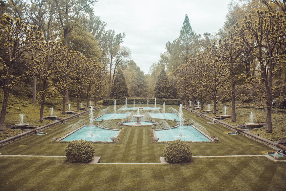 a large pool with a fountain in it
