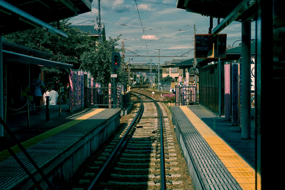 a train station with people waiting,