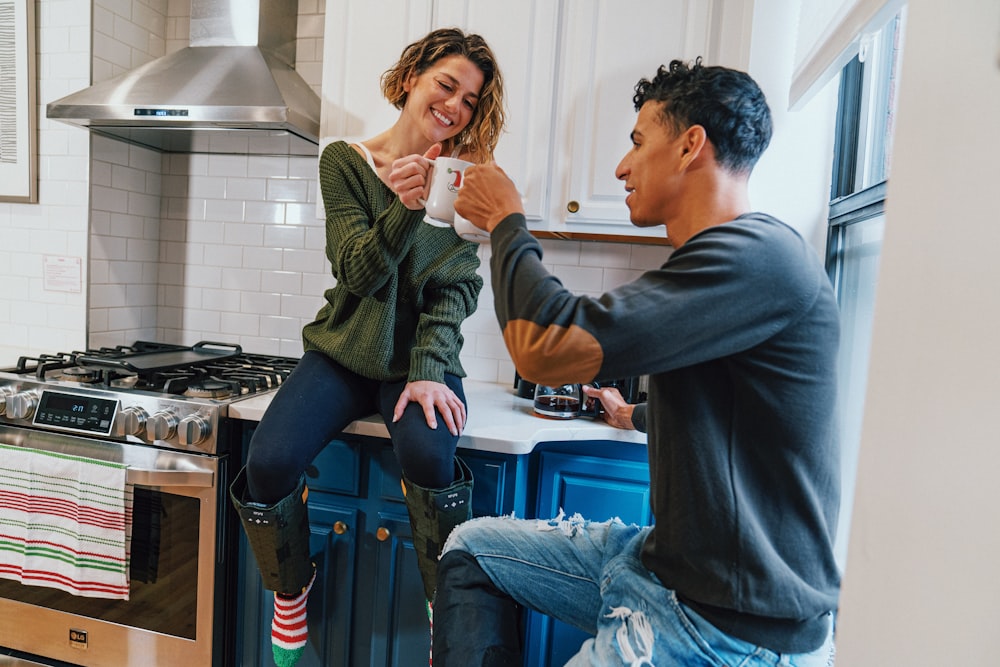 a man and a woman in a kitchen