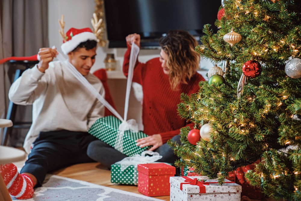 a man and a woman opening presents