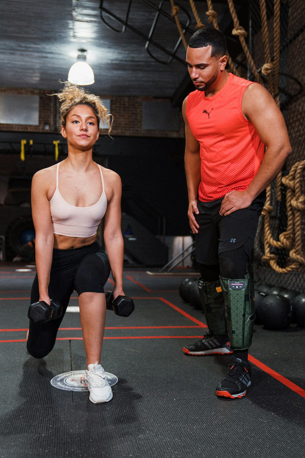 a man and a woman in a gym