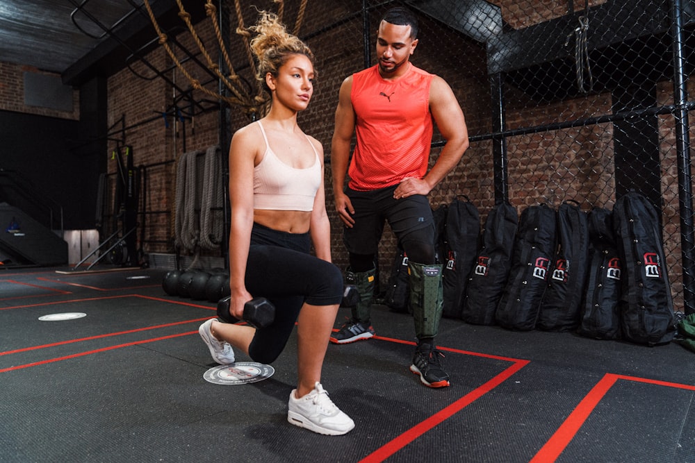 a man and a woman in a gym