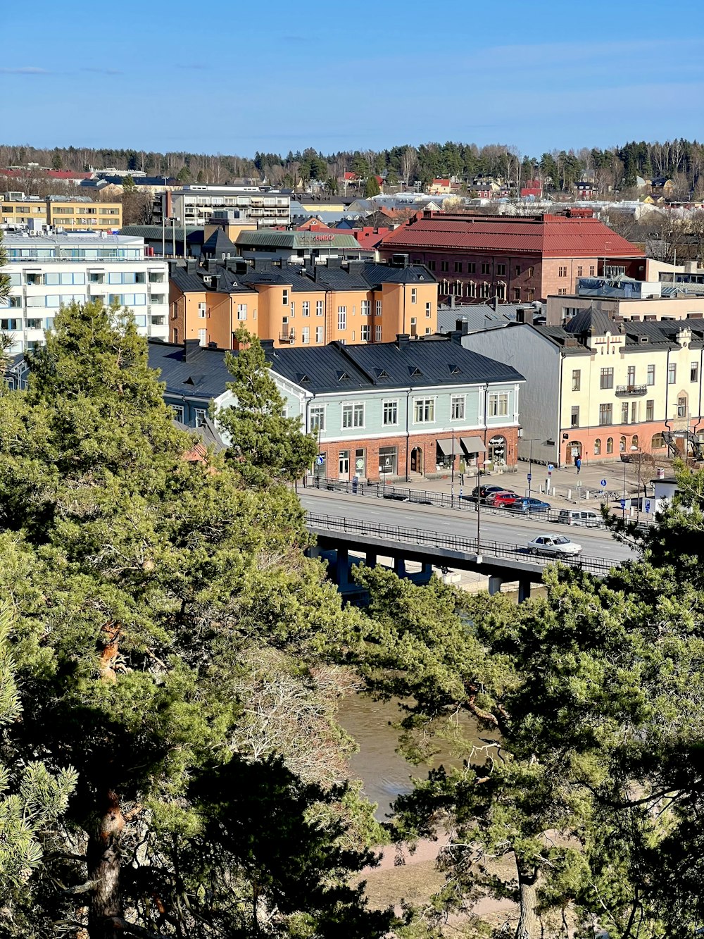 a group of buildings with trees in front of them