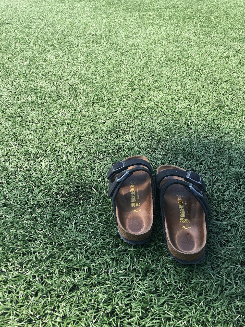 a pair of shoes on grass