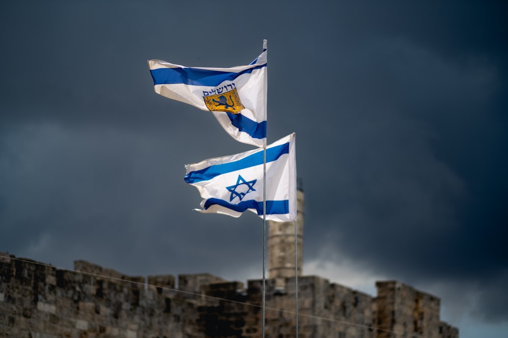 a few flags flying in the air