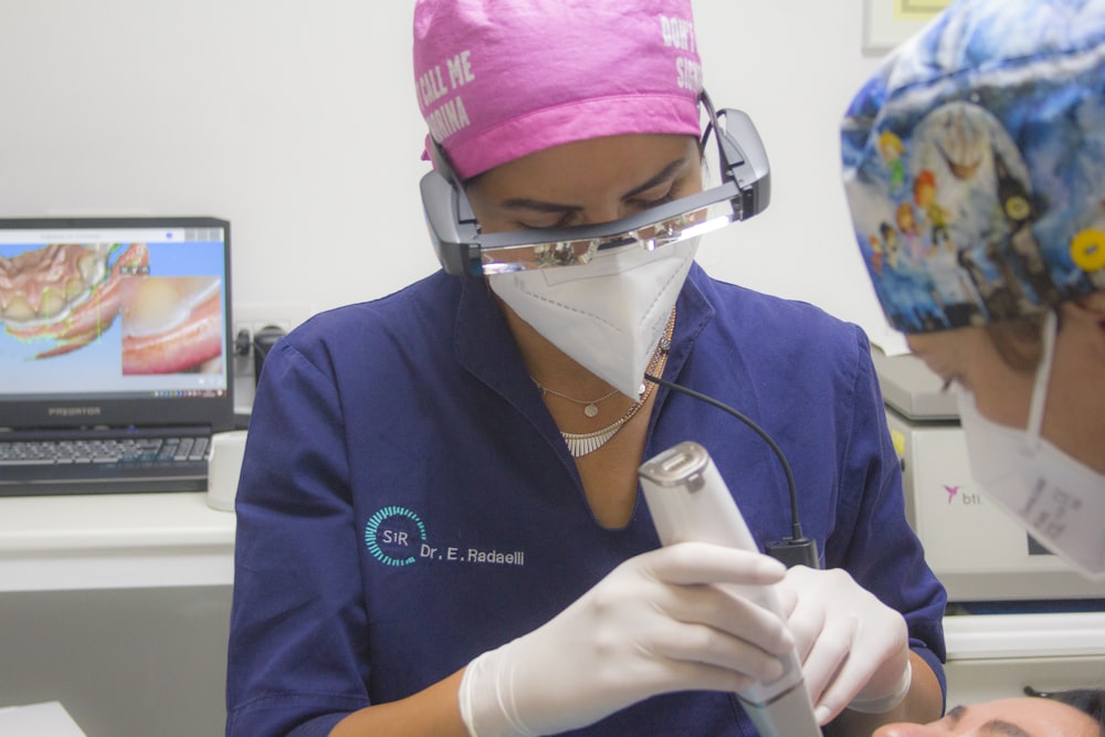 a doctor using a stethoscope on a patient's neck