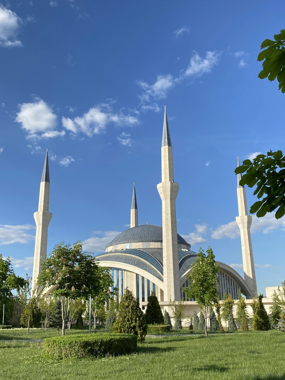 a building with towers and trees