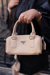 a person carrying a purse