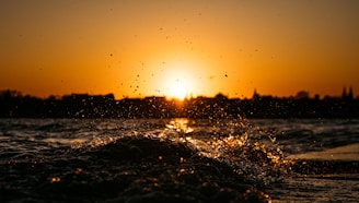 a sunset over a body of water