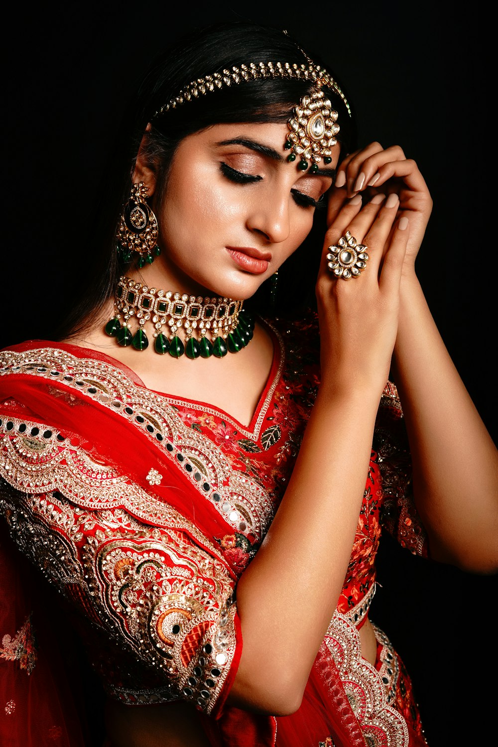 a woman wearing a red dress and a crown