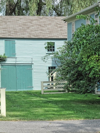 Charming exterior of a well-maintained residential complex surrounded by greenery.