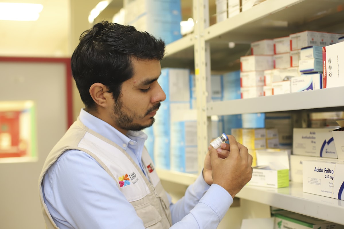 Pharmacy technician using AI tools at the pharmacy counter in 2026