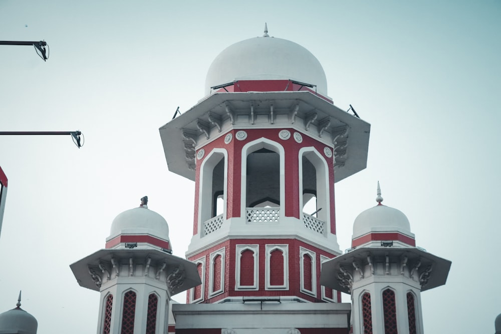 a white building with red and white domes