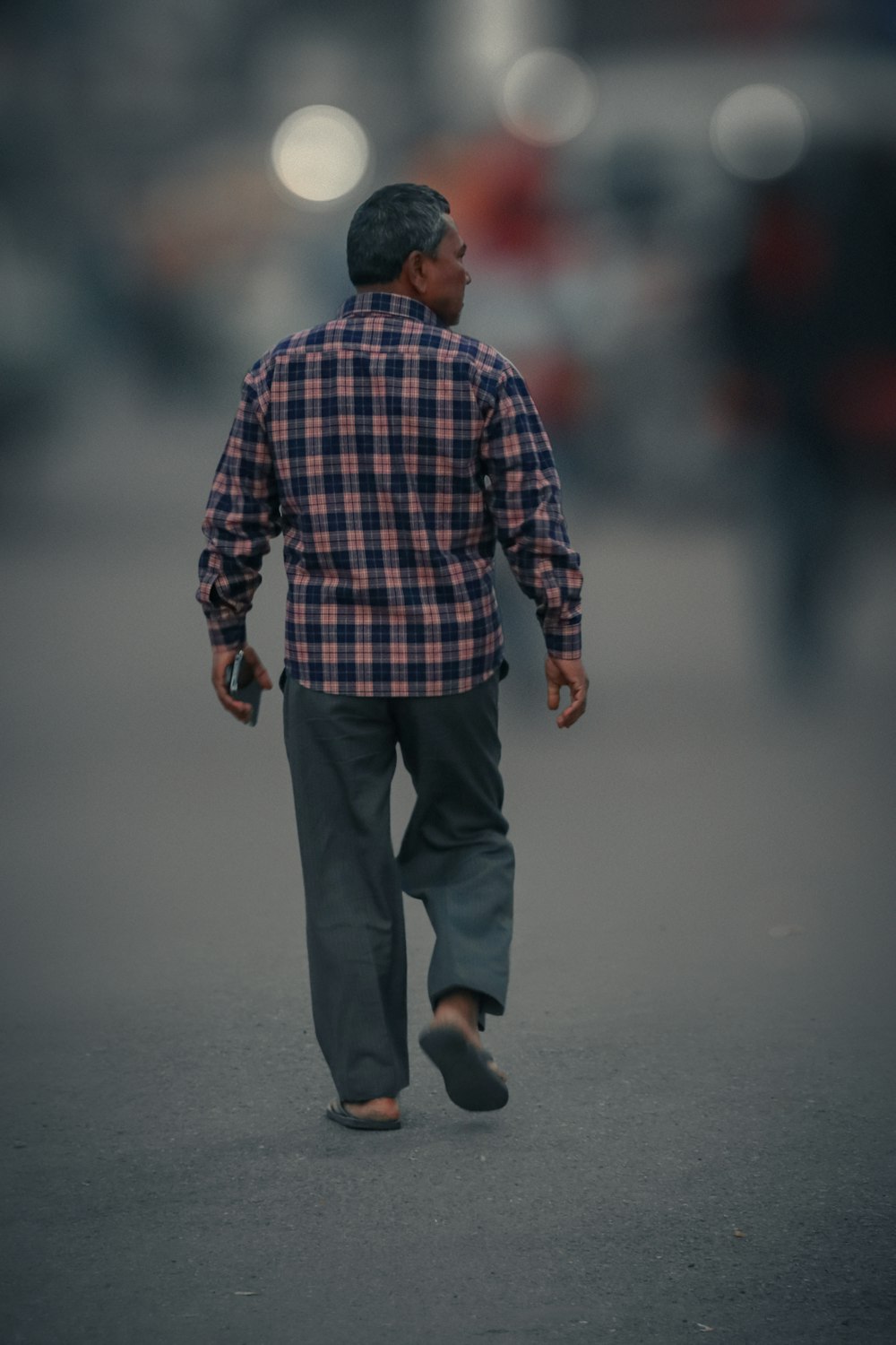 a man walking on a road