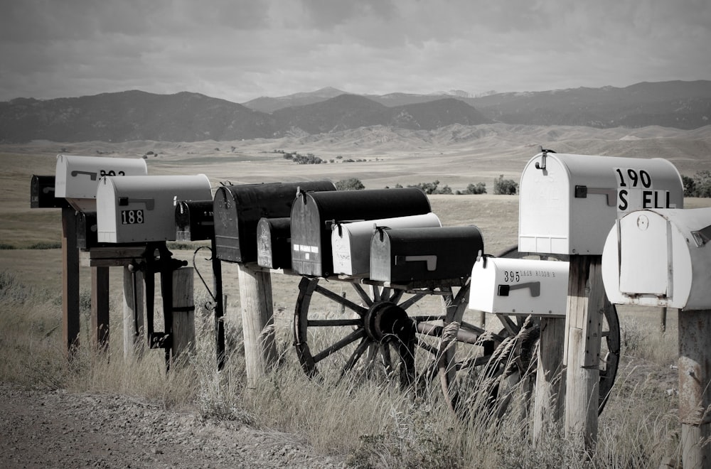 a group of white and black machines in a field