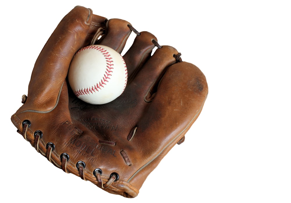 a baseball glove with a baseball in it