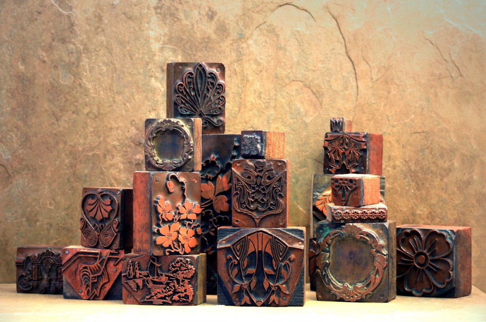 a group of vases are lined up on a shelf