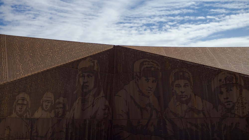 a wall with a painting of people