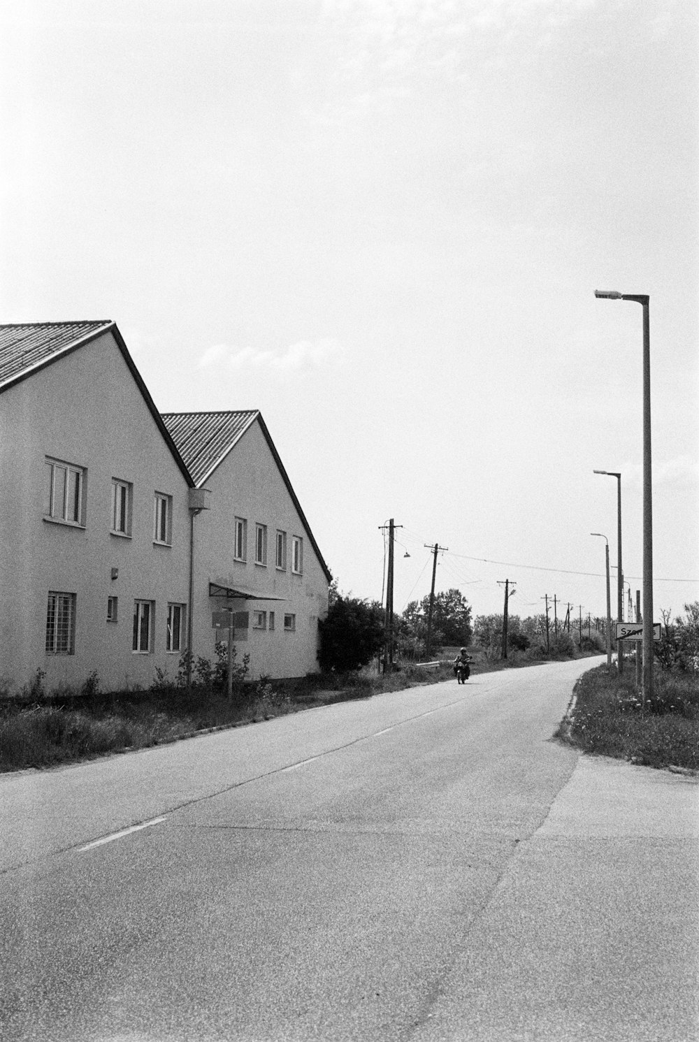 a person riding a motorcycle down a road