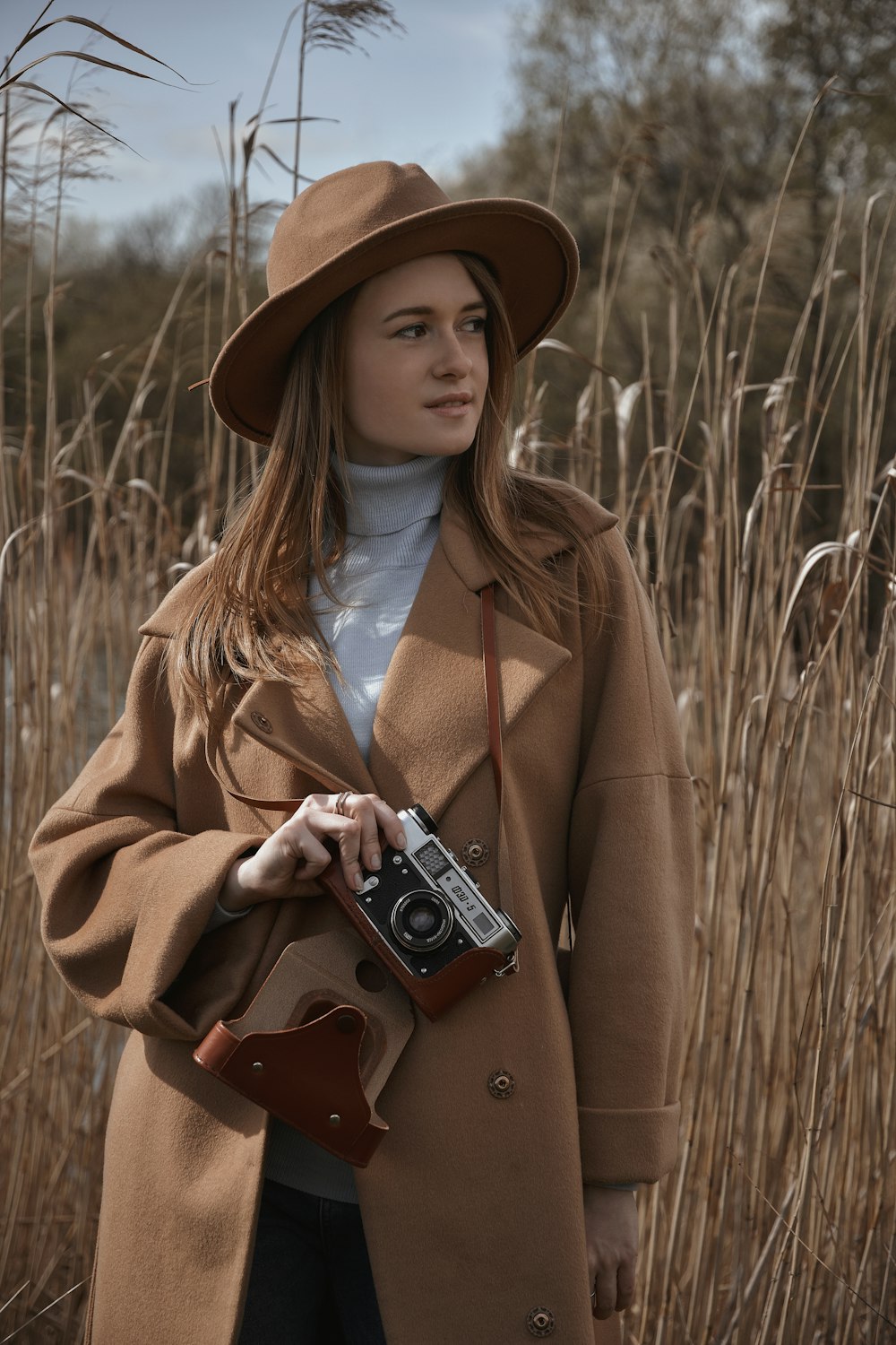 a woman holding a camera