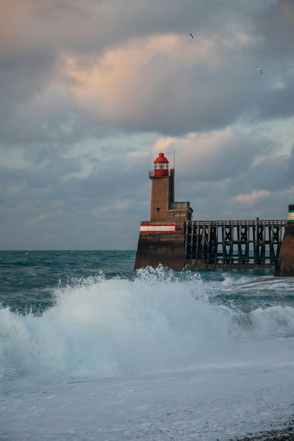 a lighthouse on a pier