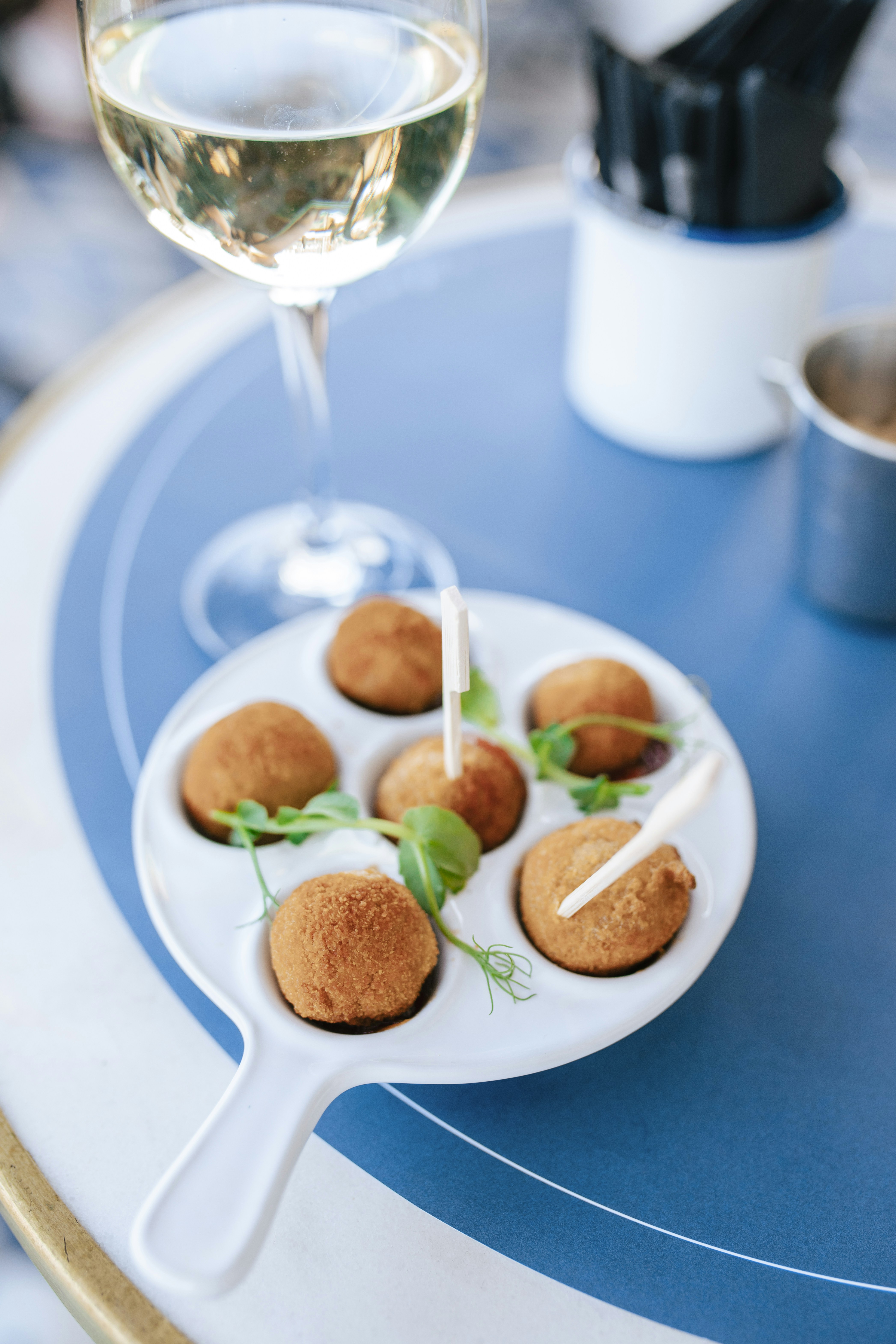 a plate of food and a glass of wine