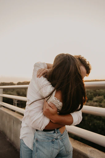 a man and woman kissing