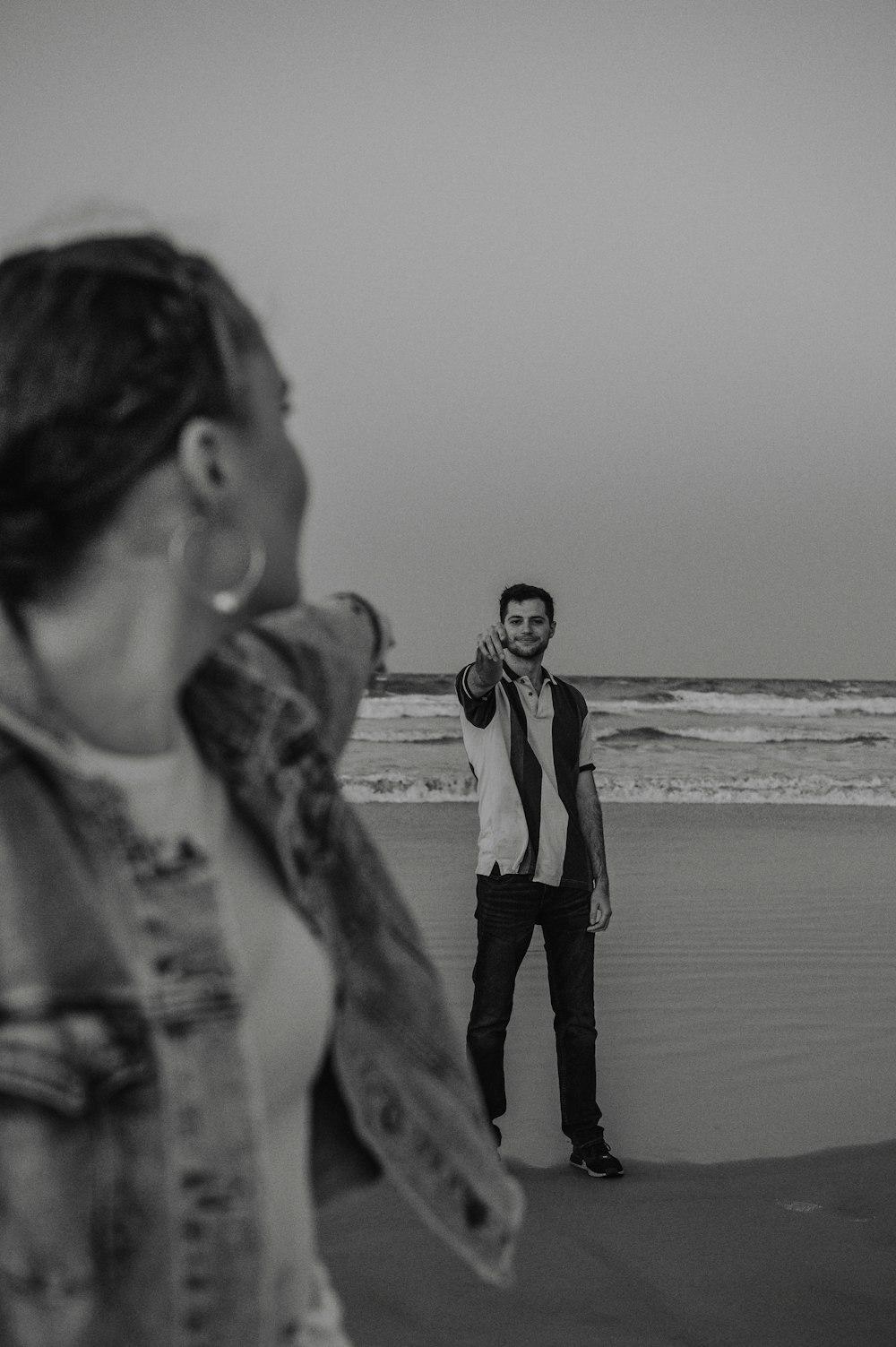 a man and woman on a beach