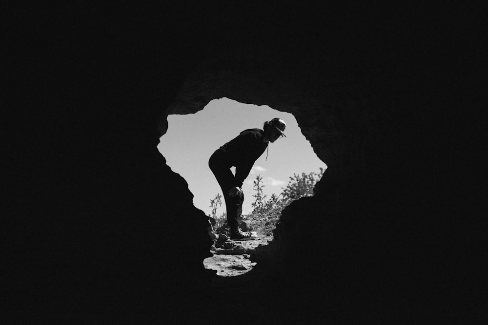 a man standing in a cave