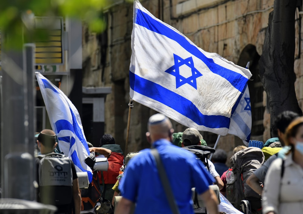 a group of people holding flags