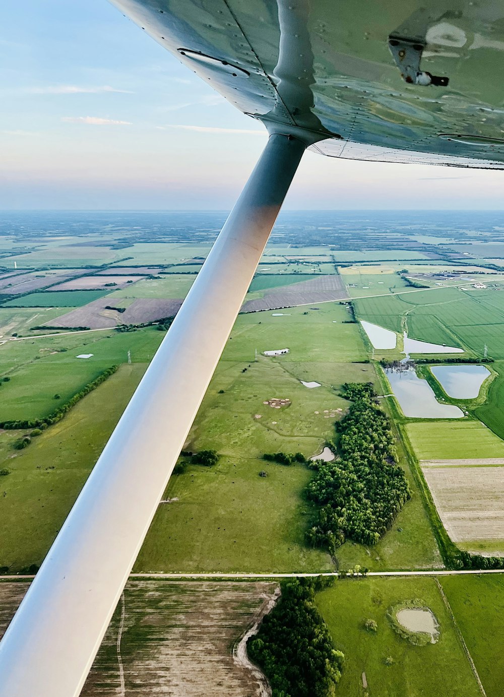 a plane flying over a field