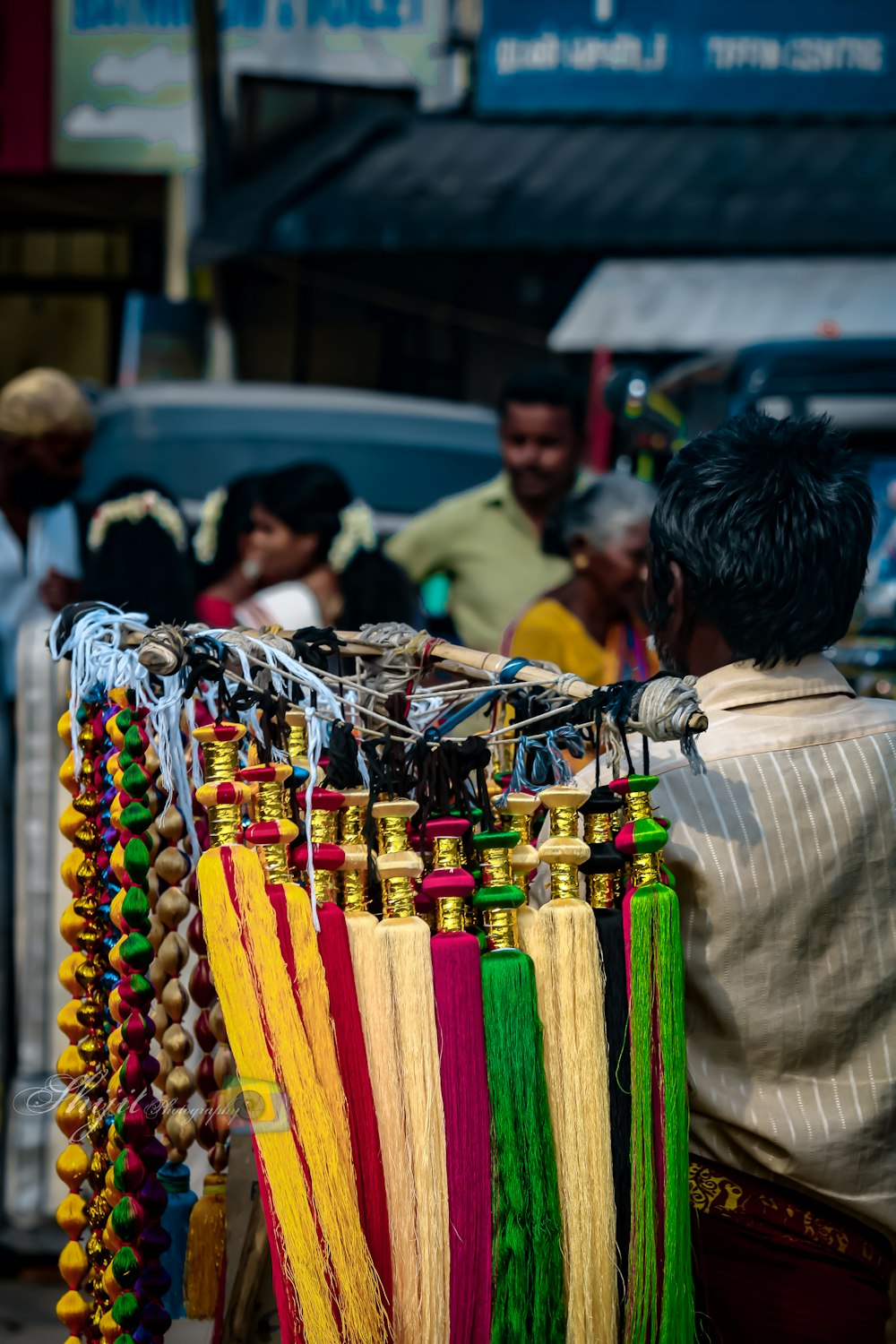 a person selling colorful ties