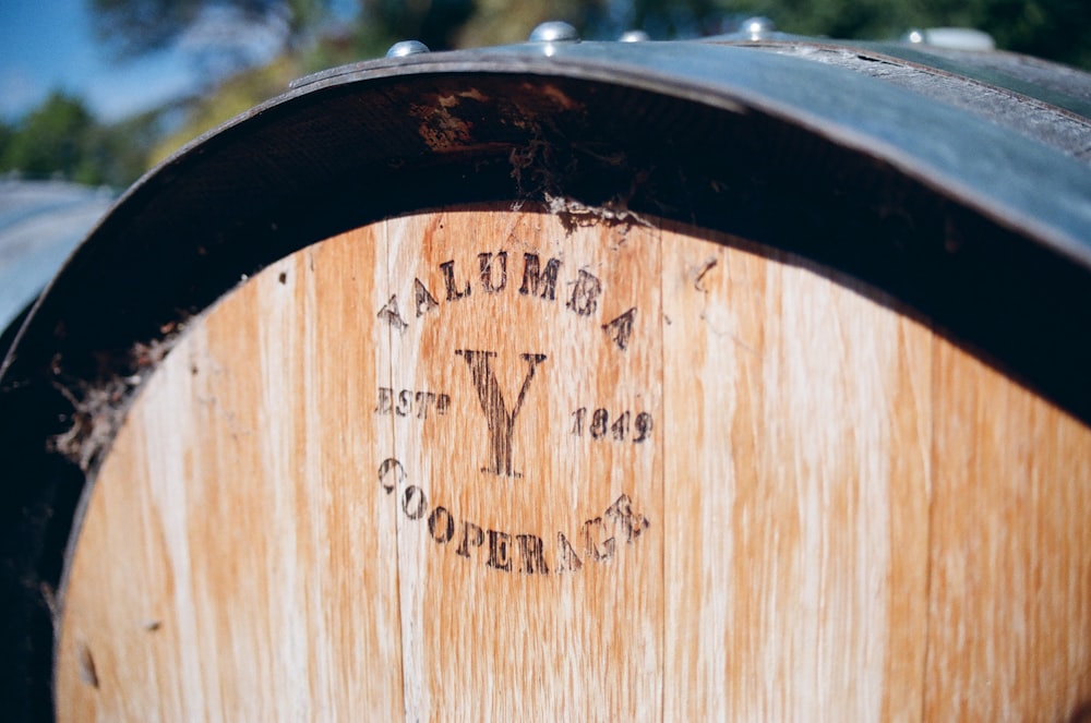 a wooden sign on a wooden fence