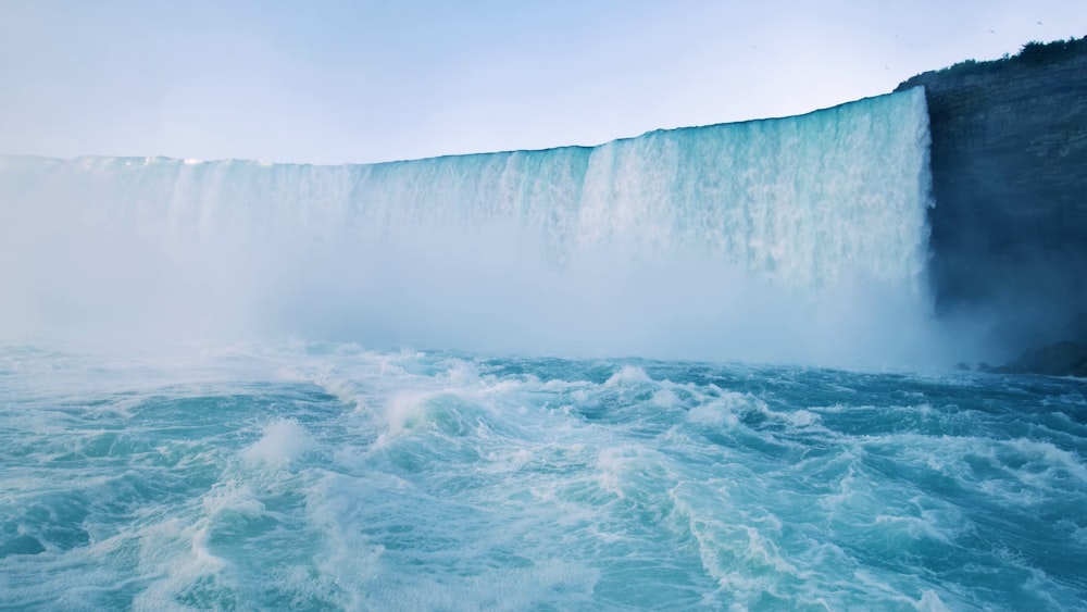 a large waterfall with a large waterfall