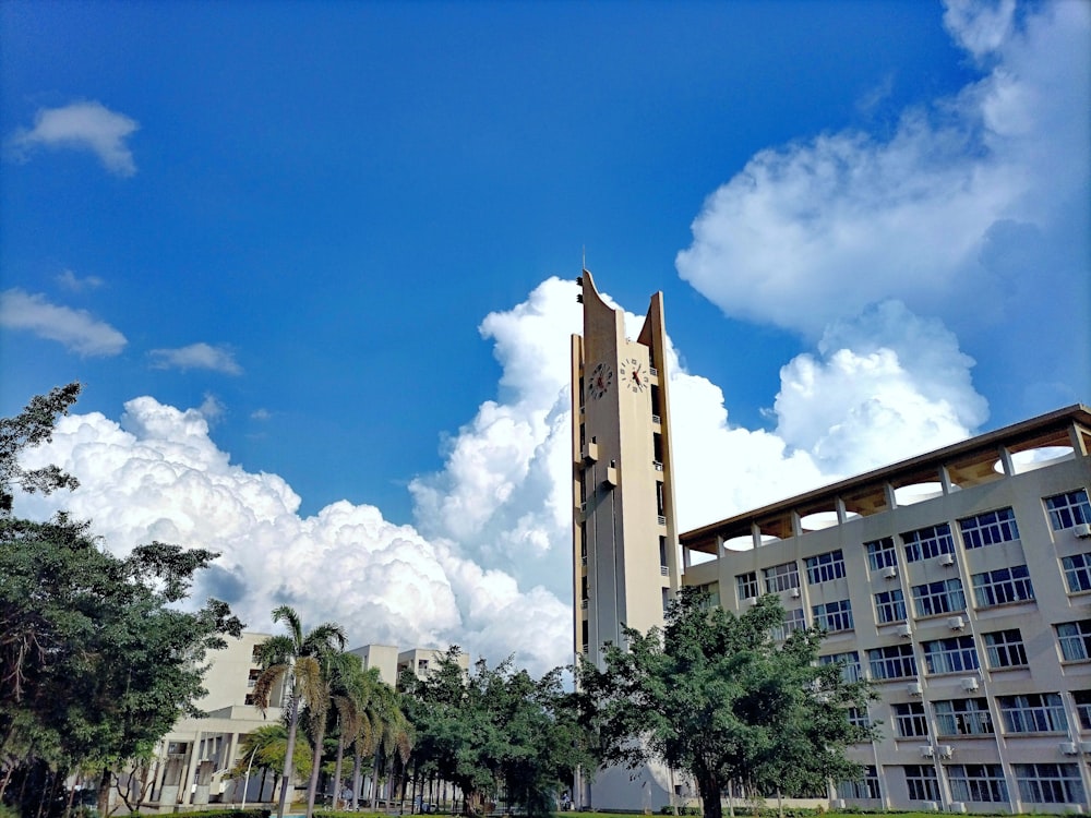 a tall building with trees in front of it