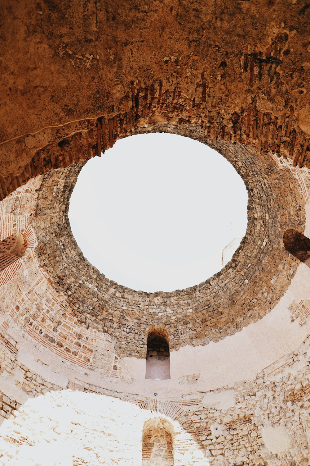 a circular stone structure with a hole in it