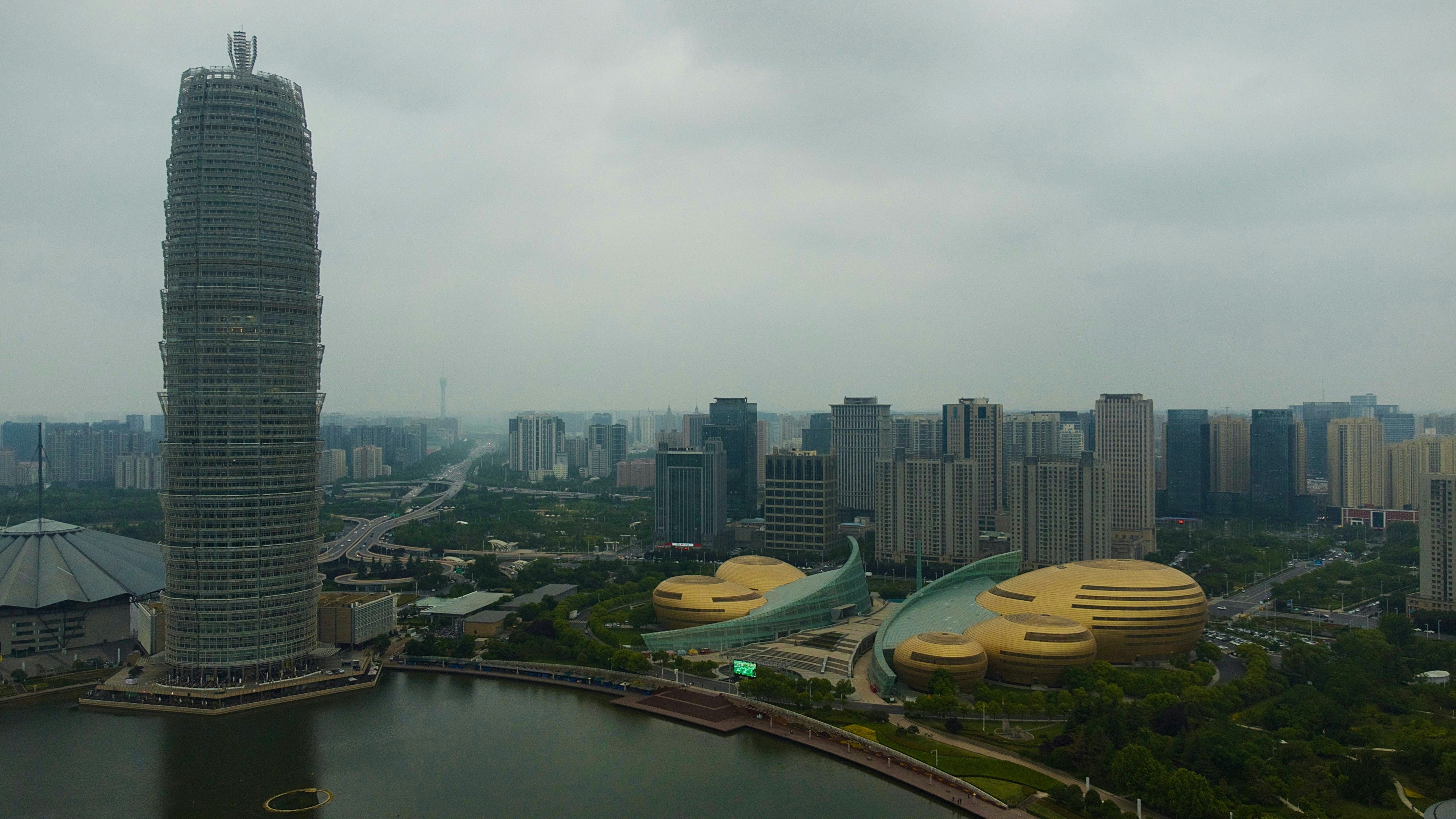 a city with a body of water and buildings